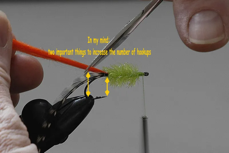 Step 9 - trim the tail - Now cut the tail off
In my experience it has proven very well to:
- let the body material end in the position of the hook point
- and end with the bobtail where the arch is
Following this instruction you get a rather small fly in comparison to the size of the hook. But as long as I fish these flies I got more hook-ups and lost quite less fish then before. And on the other hand it seams to me, that a larger hook doesn't bother the fish at all